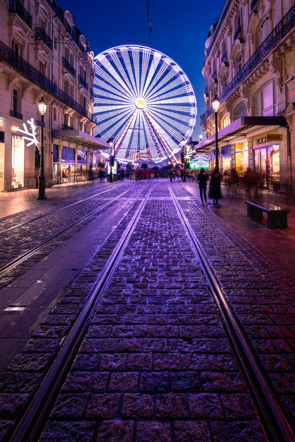 a ferris wheel in the middle of a city street