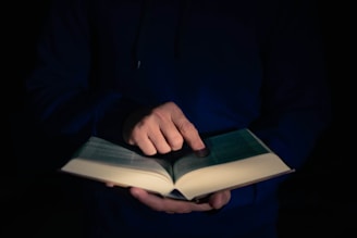 a person holding a book in their hands