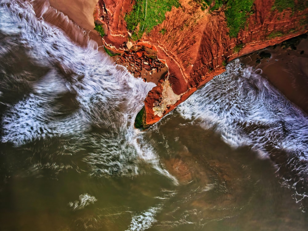 a large waterfall over some water