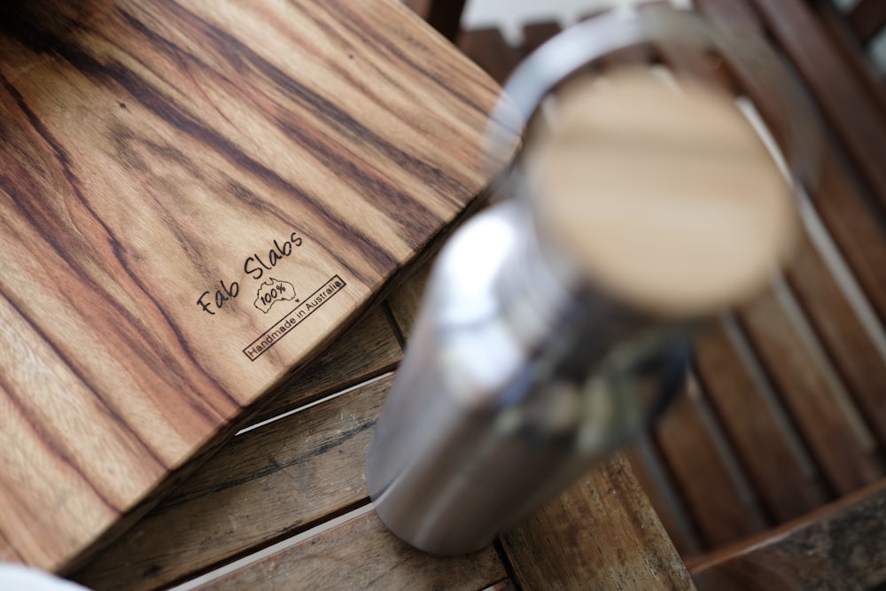 a close up of a wooden table with a knife