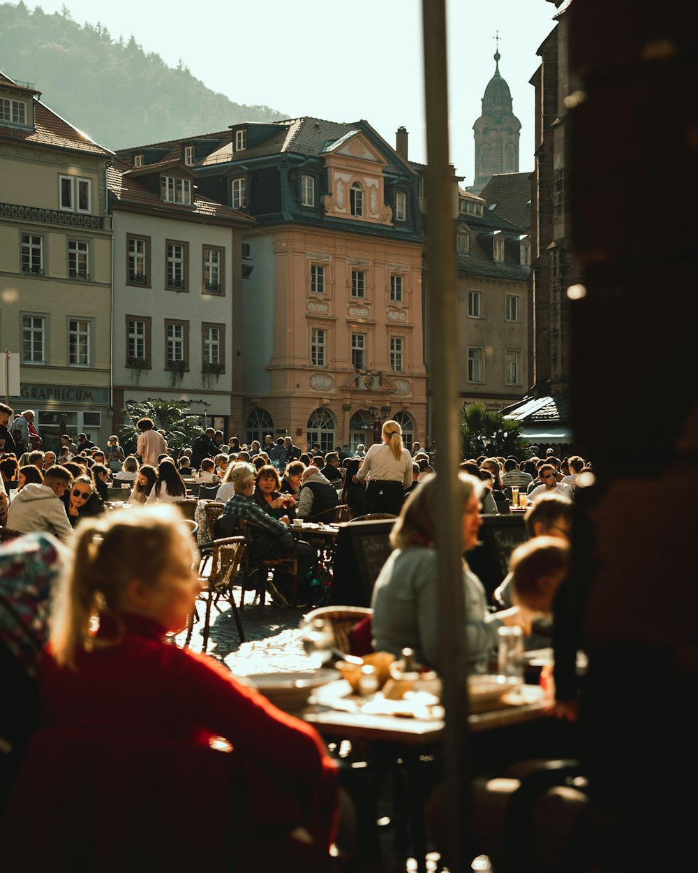 a group of people sitting at a table in front of a crowd