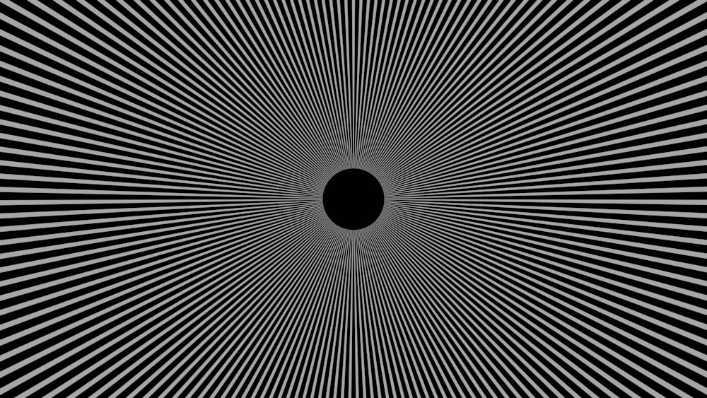 Un'immagine in bianco e nero di un buco nero