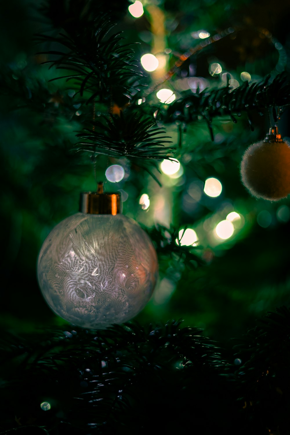 a close up of a christmas tree with ornaments