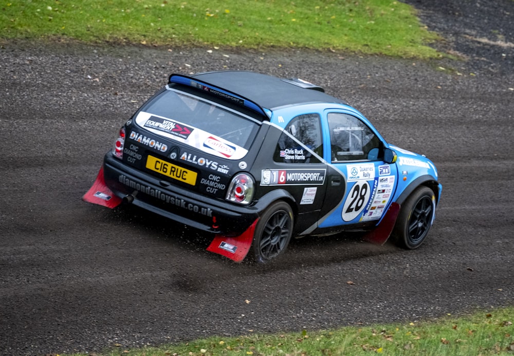 a small car driving on a race track