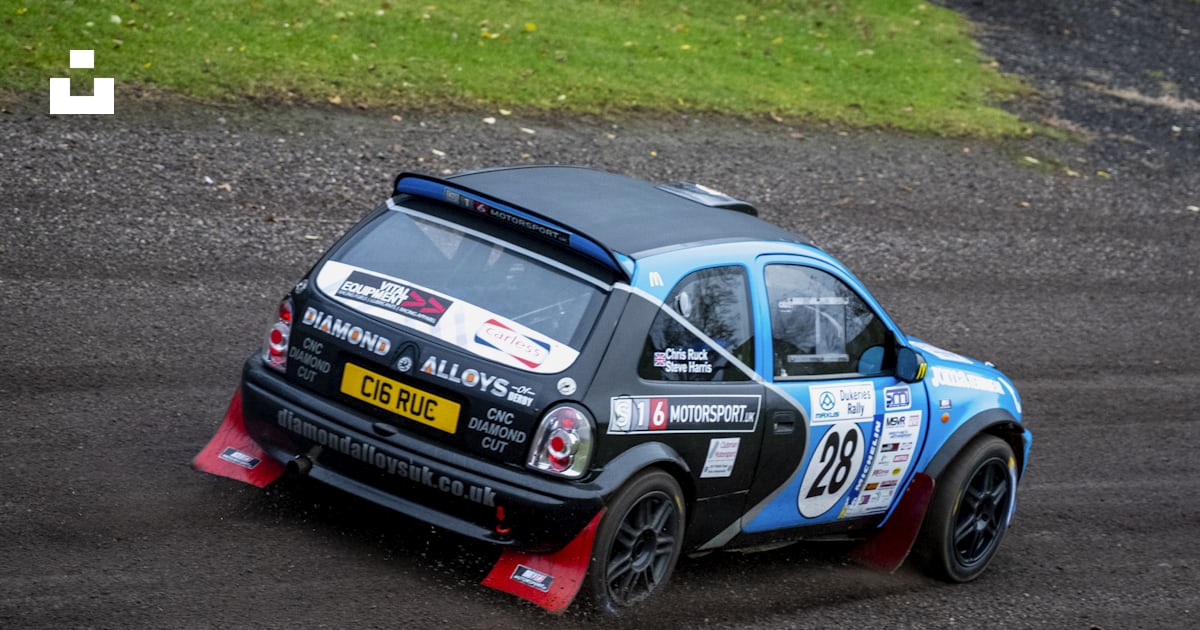 A small car driving on a race track photo – Free Donington Image on ...
