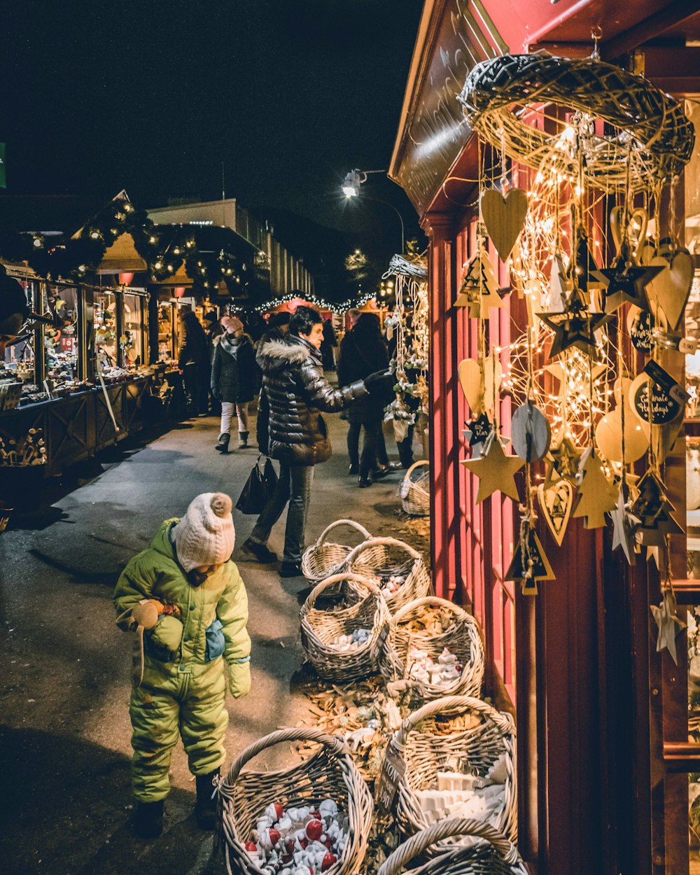 a couple of people that are looking at some baskets