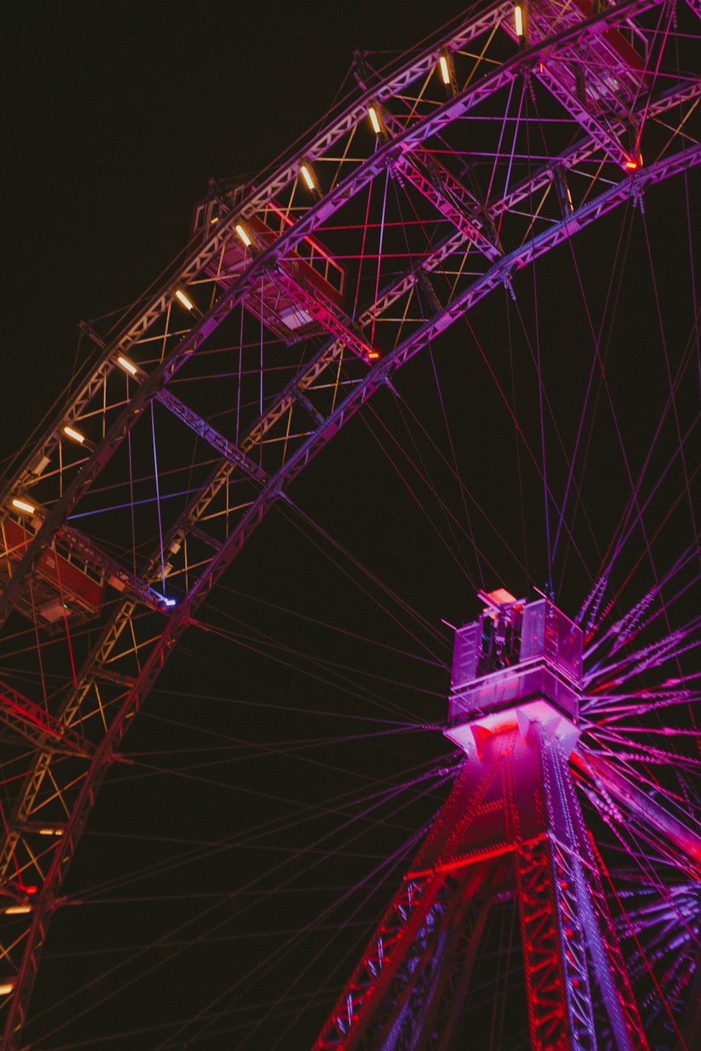 a large ferris wheel lit up at night