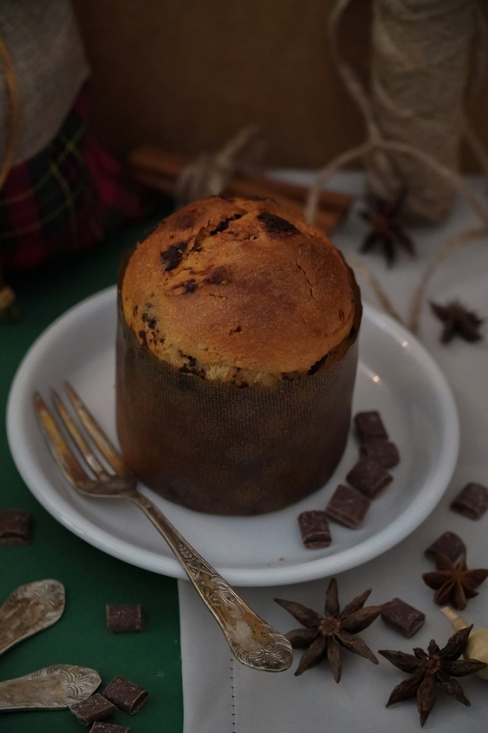 a muffin on a plate with a fork