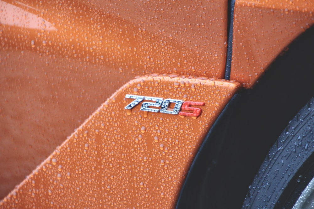 a close up of the emblem on a sports car