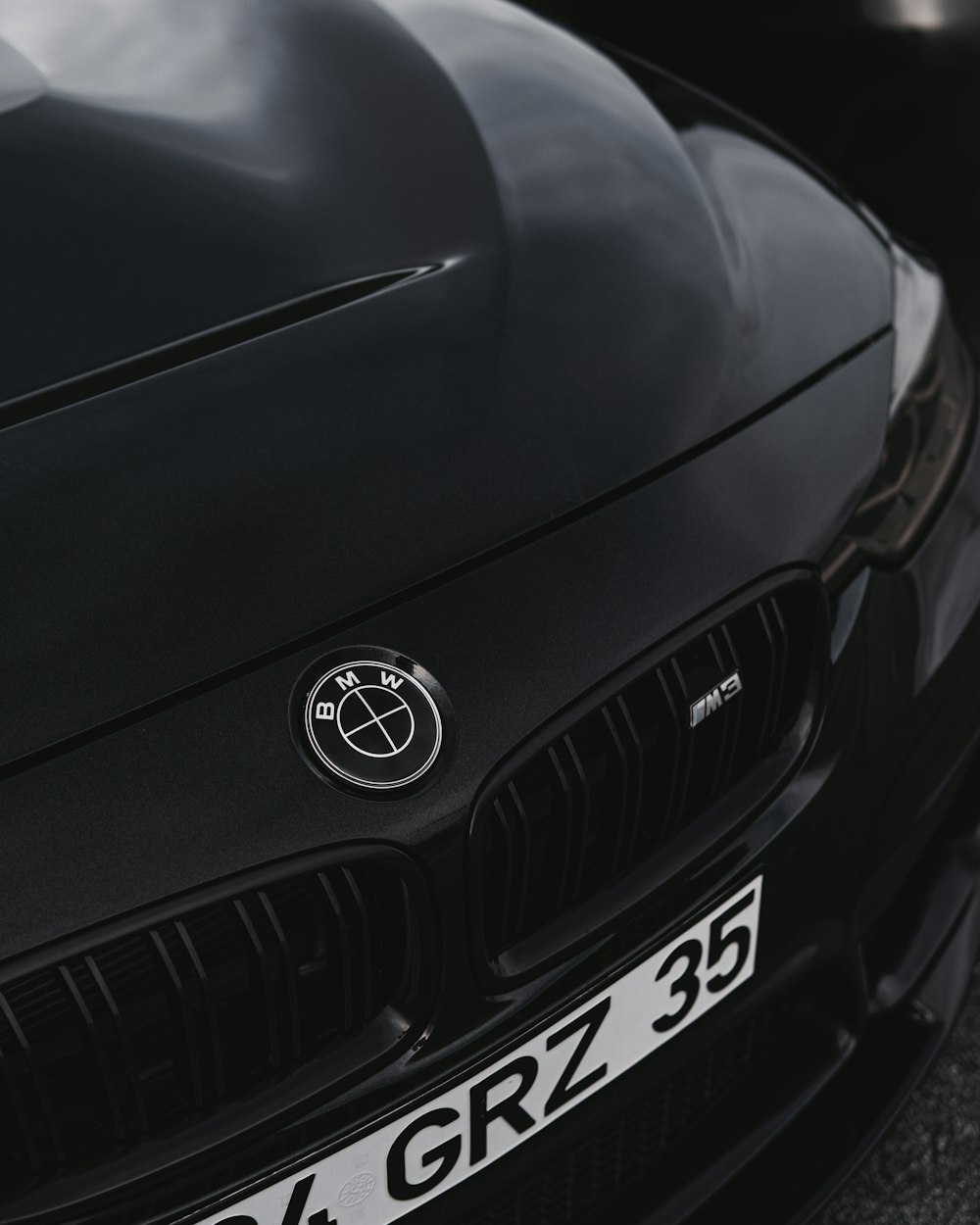 a close up of the front of a black sports car