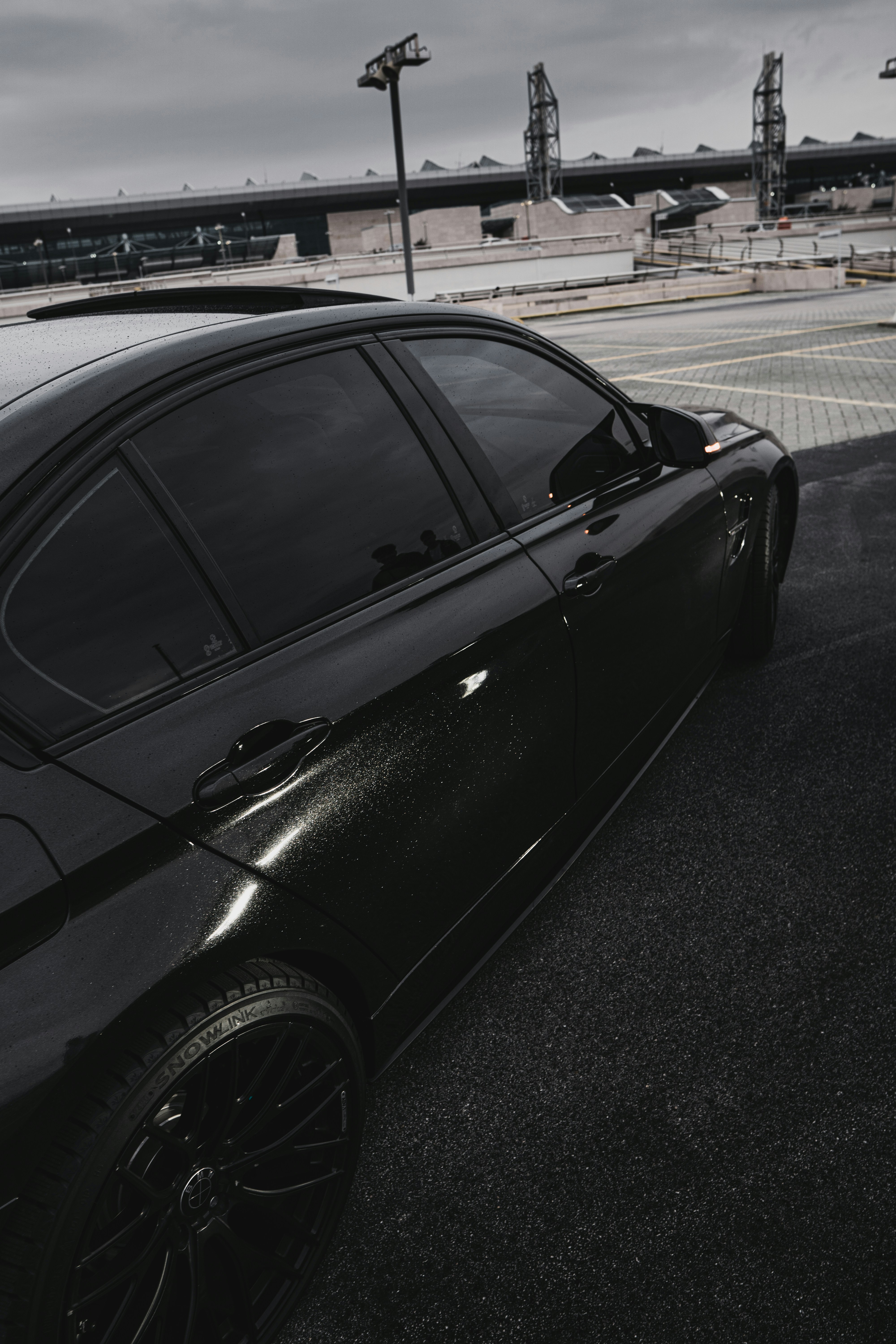 Dull faded car paint before wax treatment, matte and dirty exterior on a cloudy day