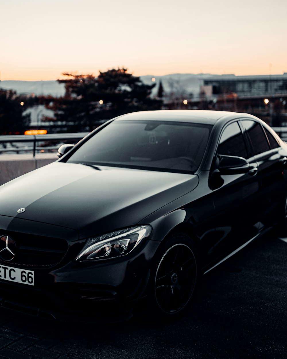 A black car parked in a parking lot photo – Free Mercedes benz