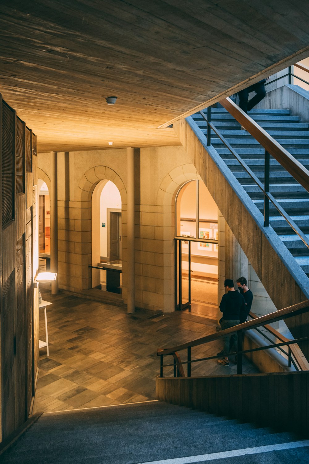 a man sitting on a bench in a building