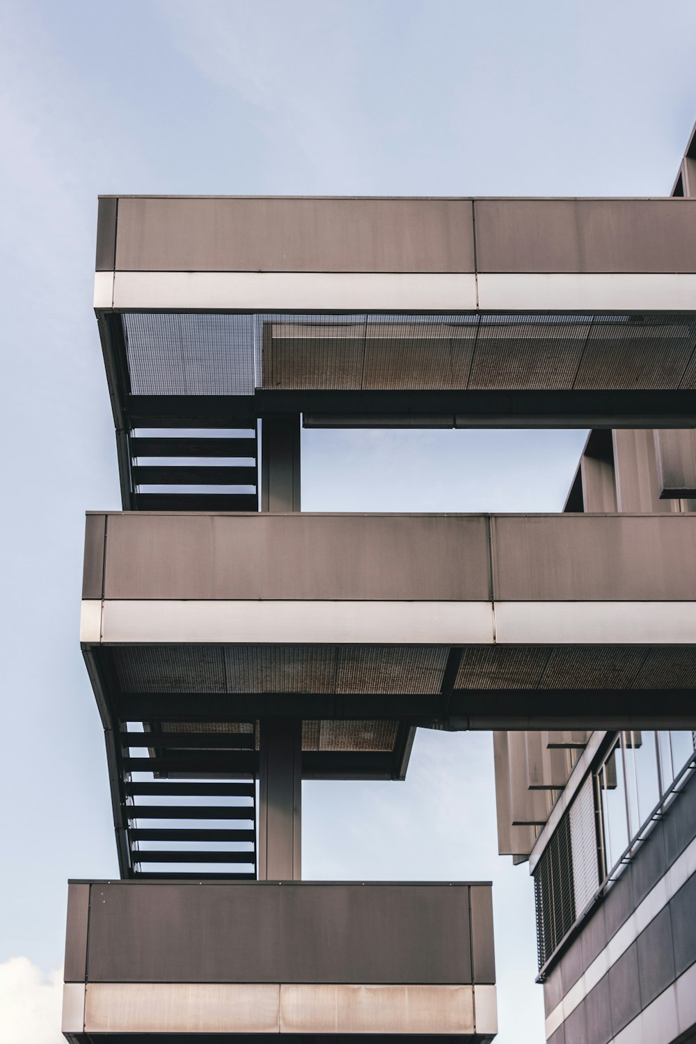 a tall building with balconies on top of it