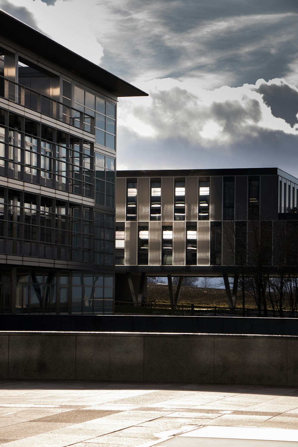 a large building with many windows and a sky background