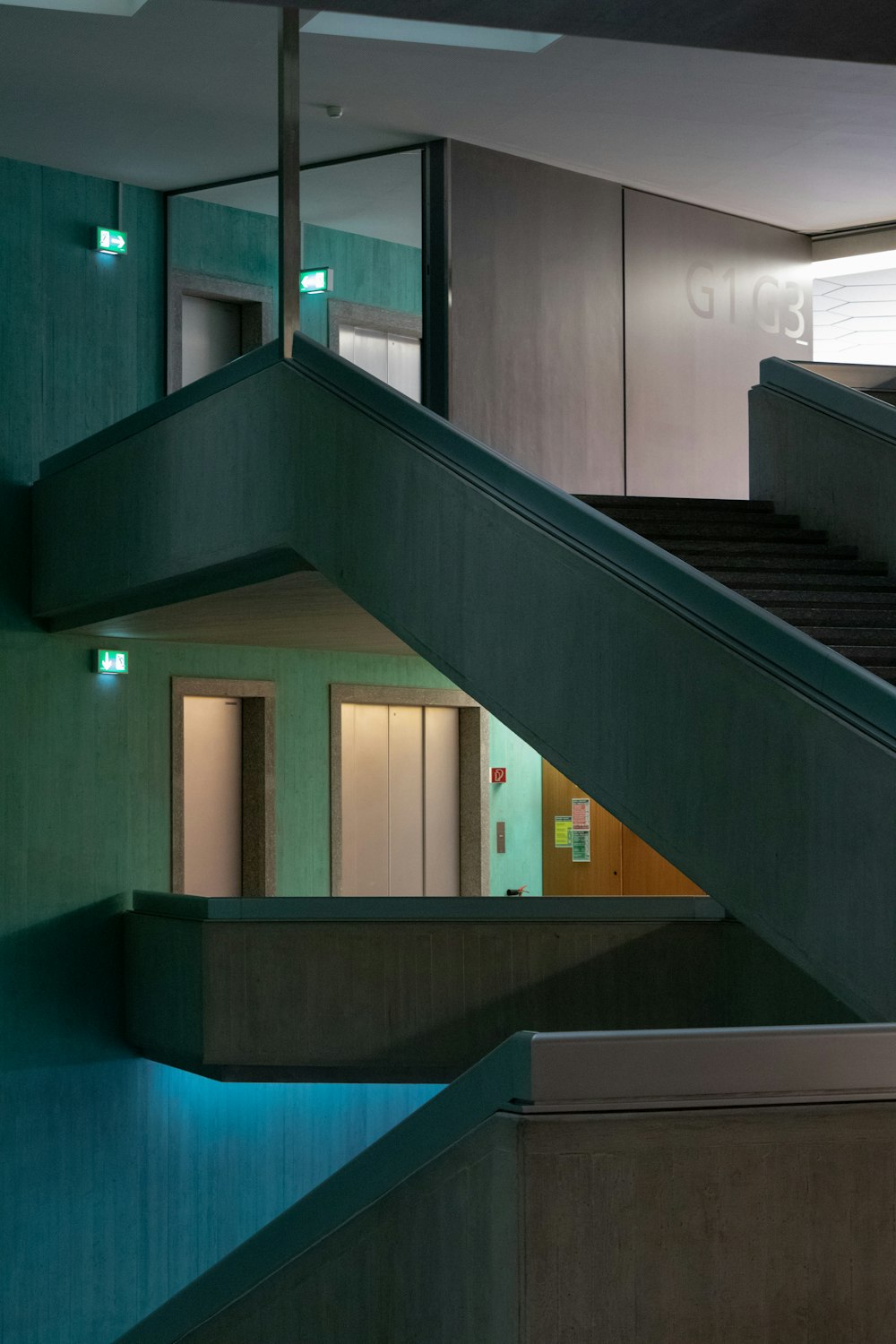 a staircase leading up to a building with a clock on it