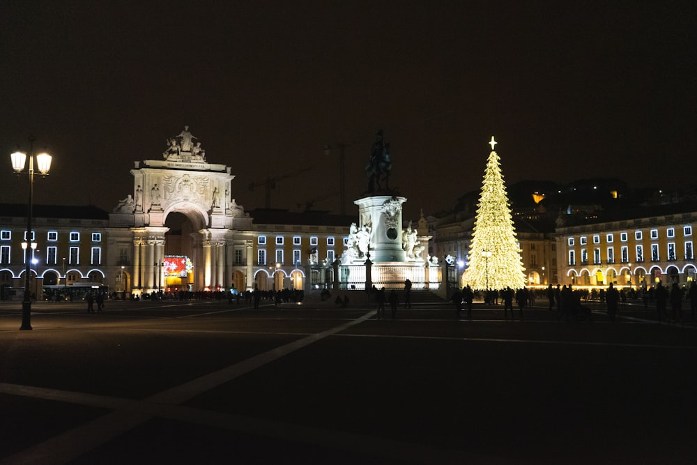 a large building with a christmas tree in front of it