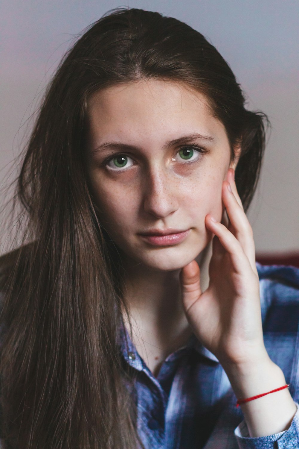 a woman with long hair is posing for a picture