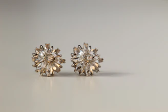 Elegant sterling silver earrings with Swarovski zirconia sparkling under soft lighting.