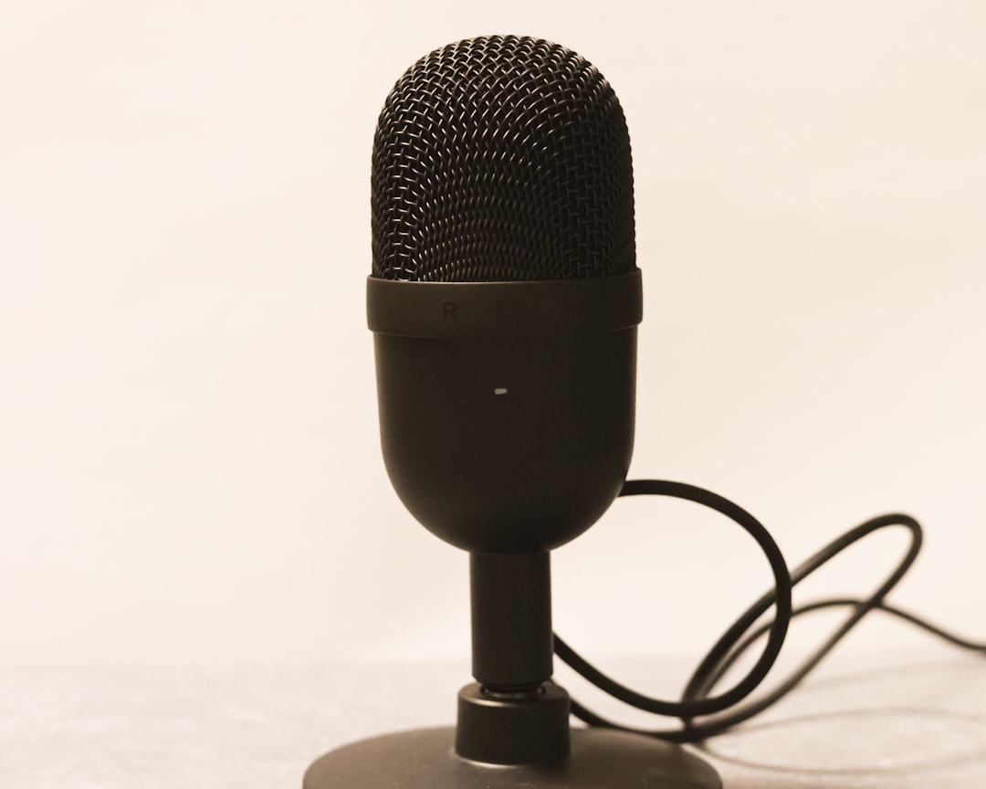 a microphone is plugged into a charger,