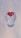A transparent, futuristic robotic head is centered against a soft gradient background. Inside the head, at the forehead, is a realistic red heart with a shining star-like sparkle.