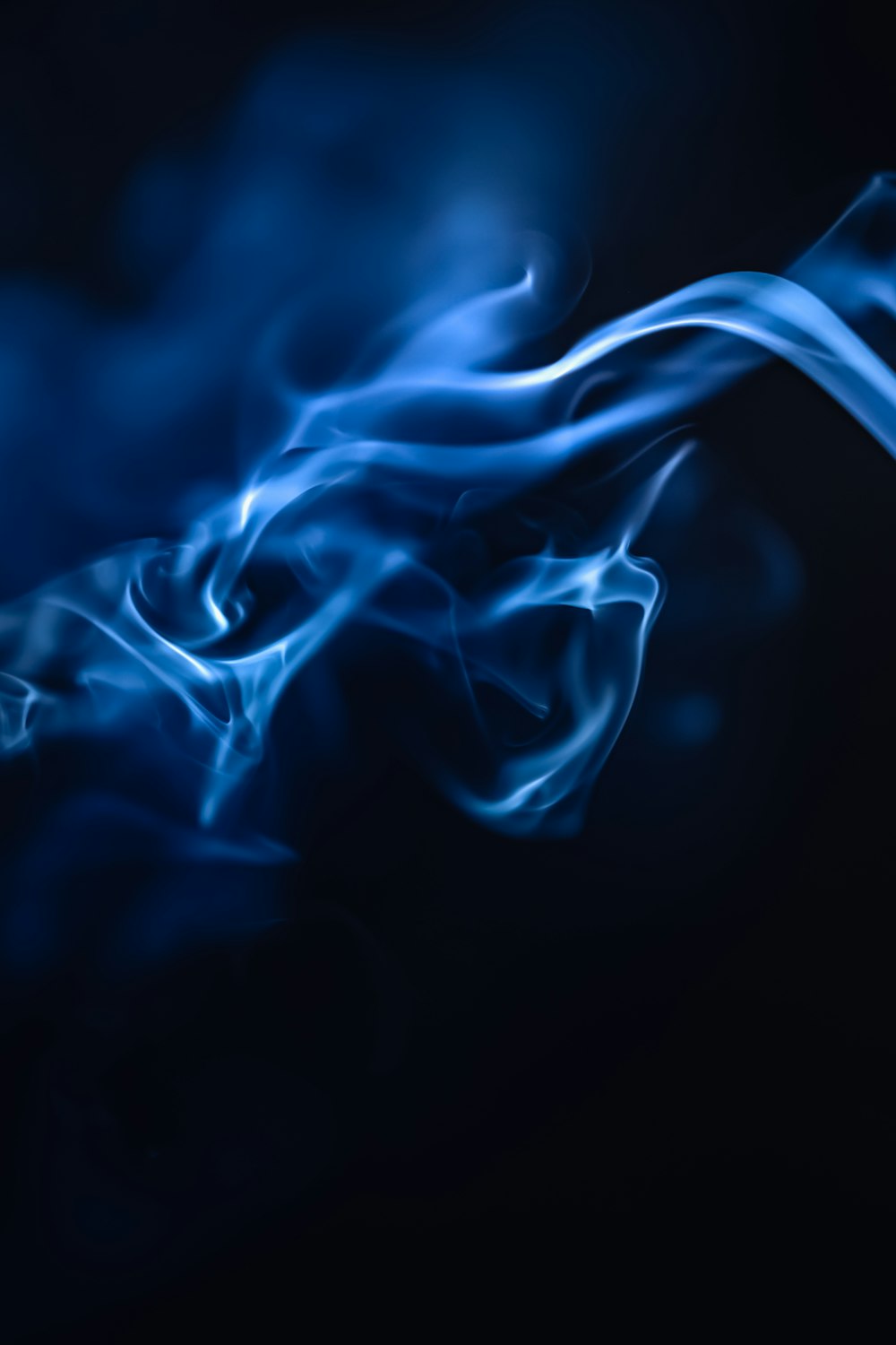 a blue smoke texture on a black background