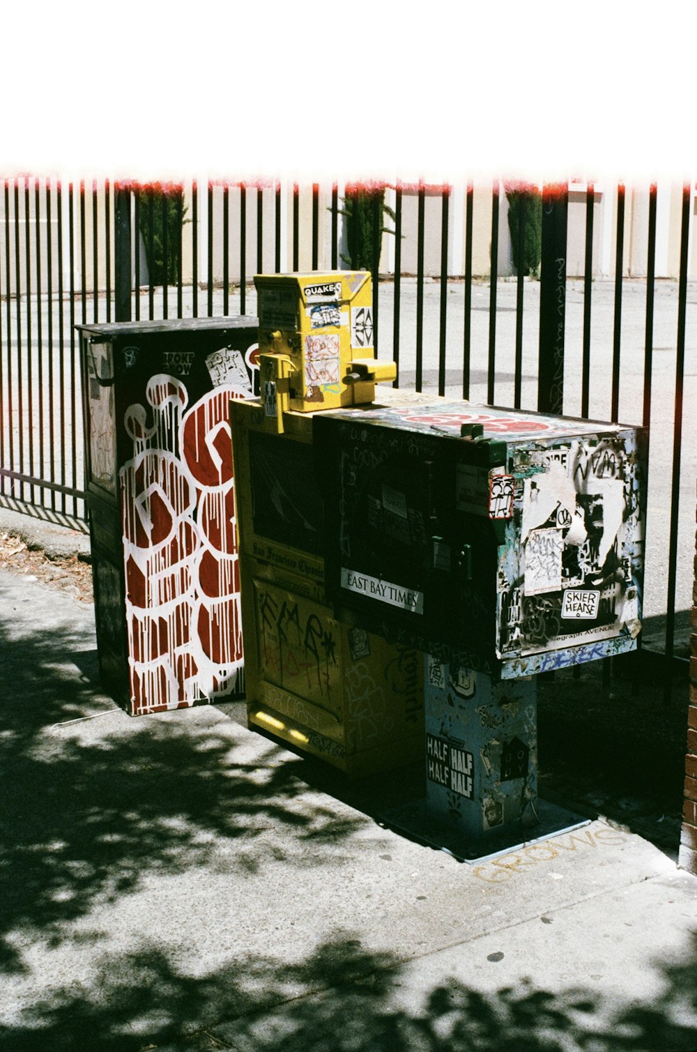 a couple of boxes sitting on the side of a road