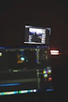 A crisp, high-resolution photo of a creative team collaborating over video editing software.
