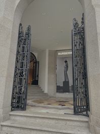 A stylish fashion house entrance showcasing modern decor.