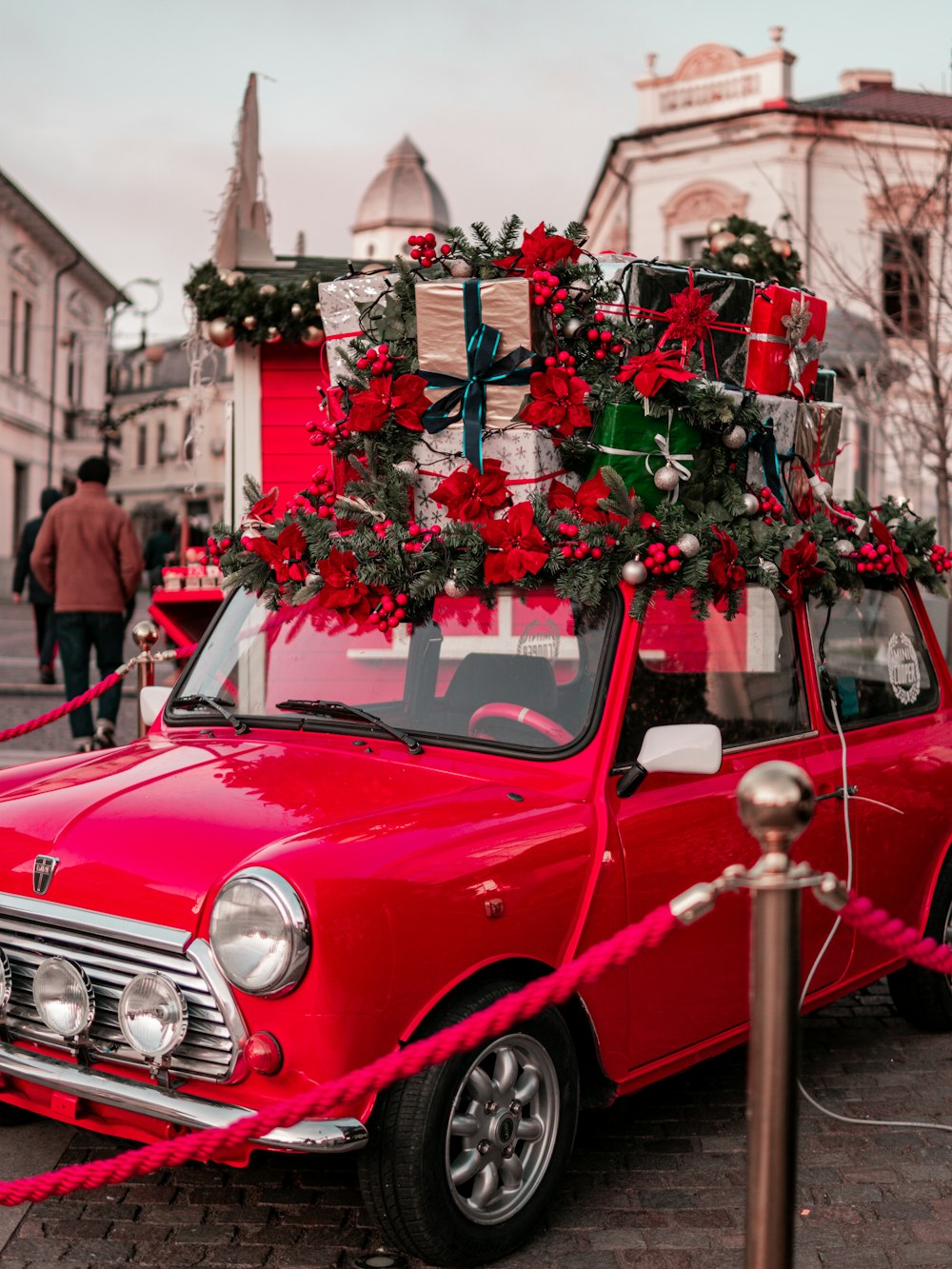a red car with a christmas tree on top of it