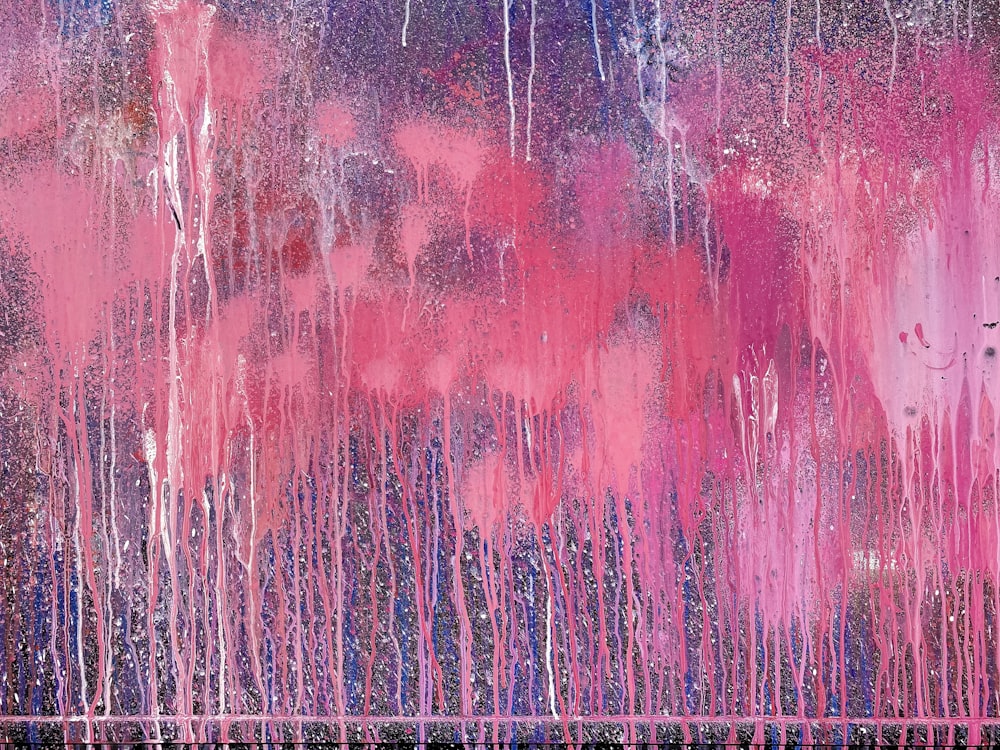 an abstract painting of pink and blue colors