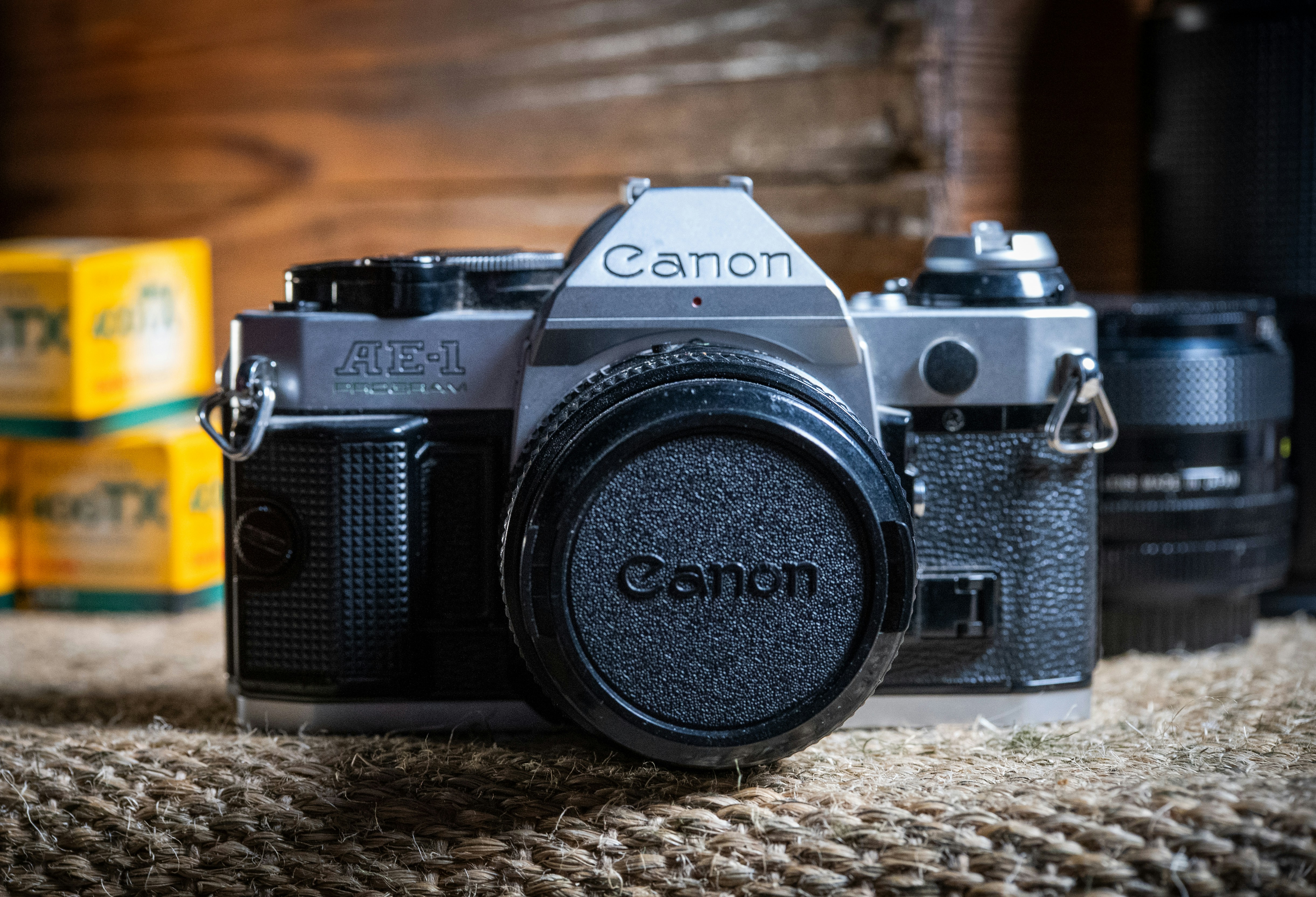 a camera sitting on top of a carpet next to boxes