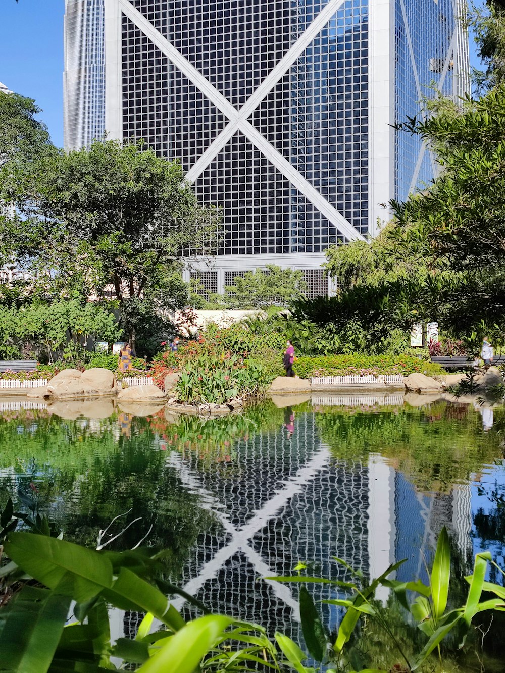 a very tall building sitting next to a body of water