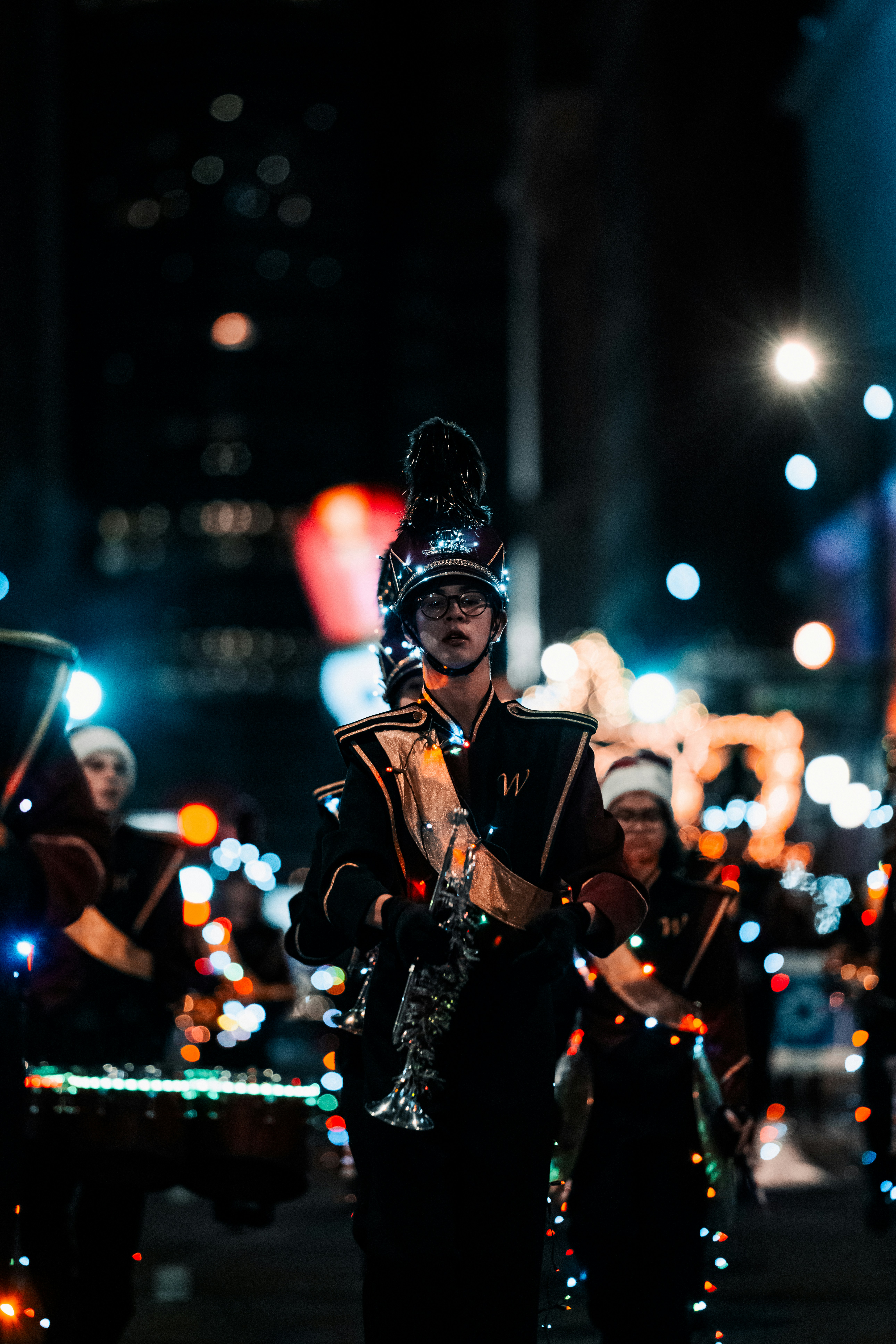 a man playing a bagpipe in a parade