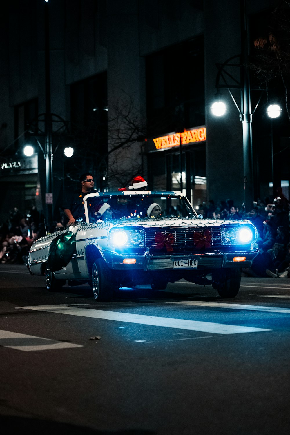 a police car driving down a street at night