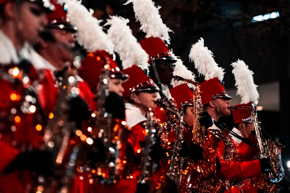 a group of people in red and white costumes