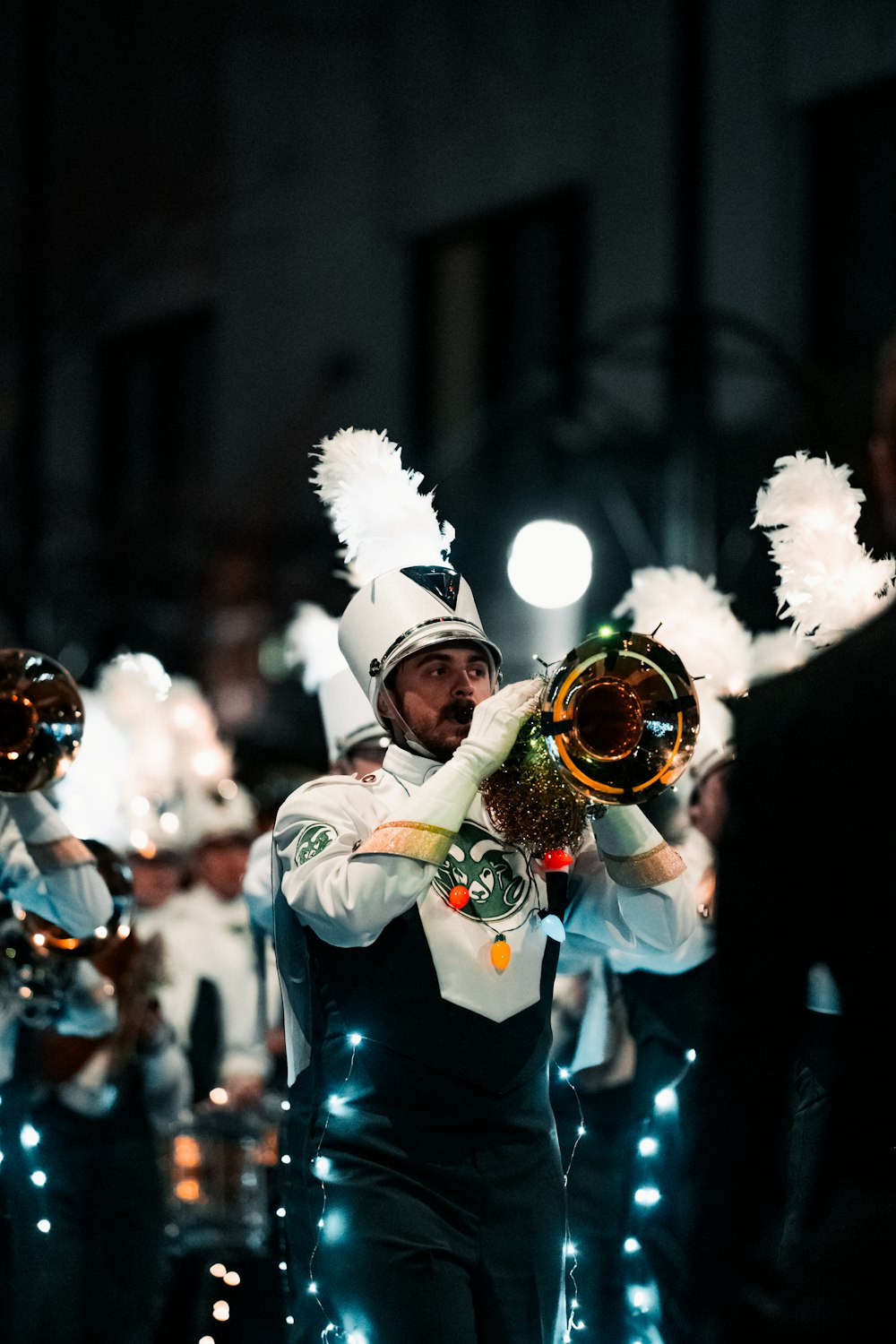 a man playing a trumpet in a parade