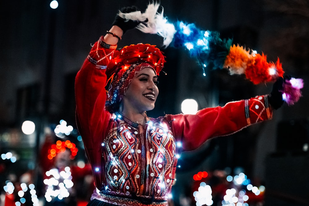 a woman in a colorful costume is dancing