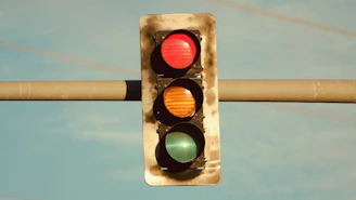 a traffic light hanging from a metal pole
