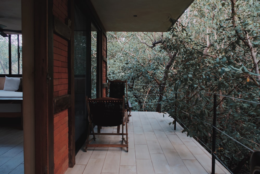 a balcony with a chair and a table on it