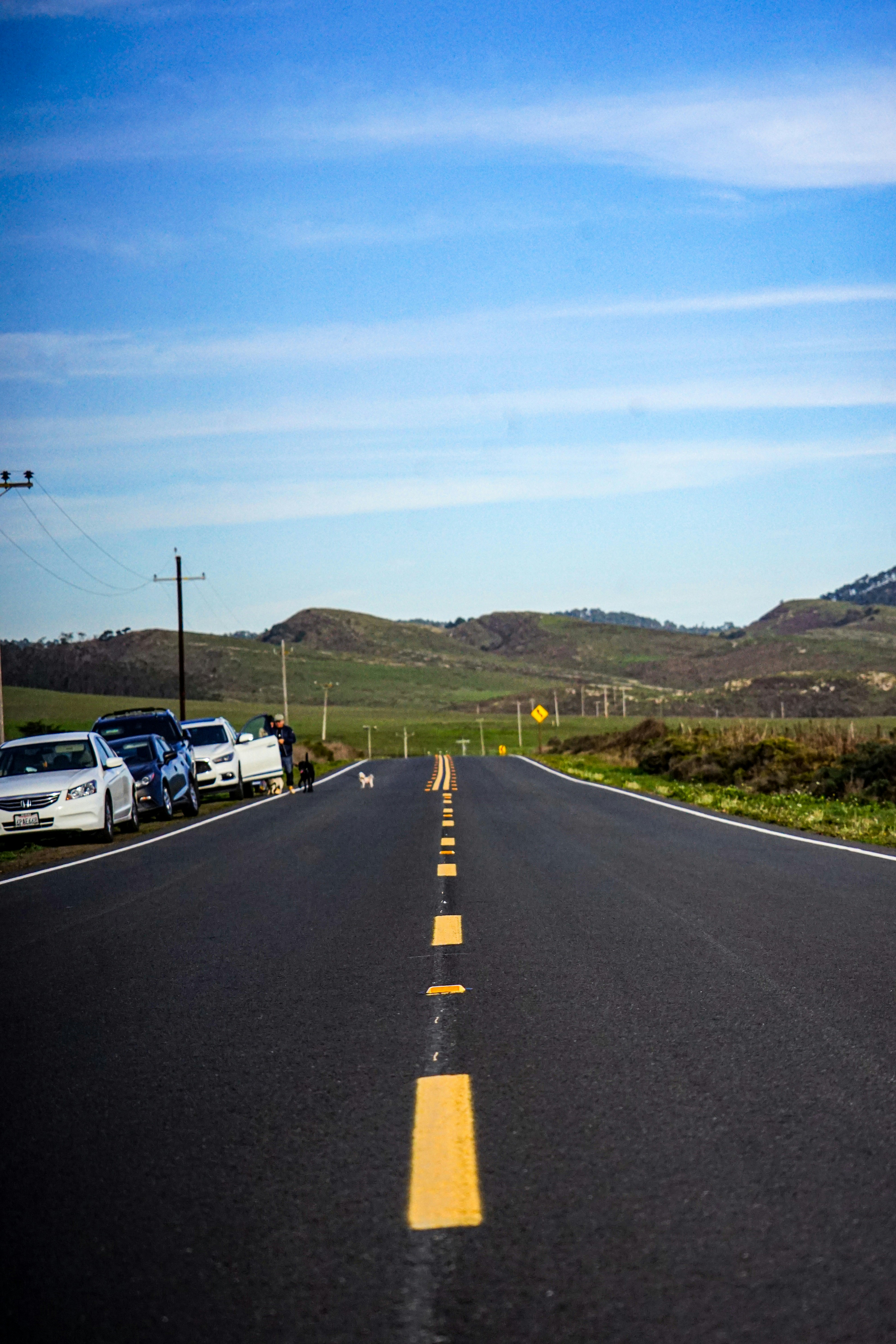 a street with a yellow line on the side of it