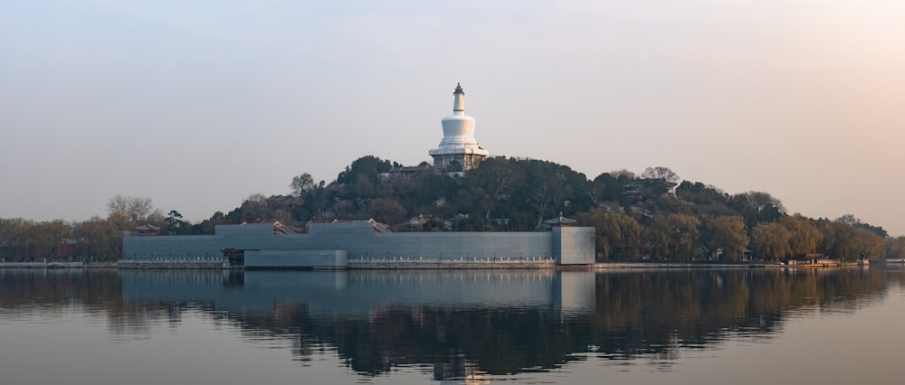 a large body of water with a building on top of it