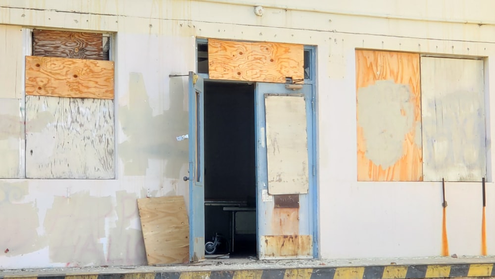 a run down building with boarded up windows