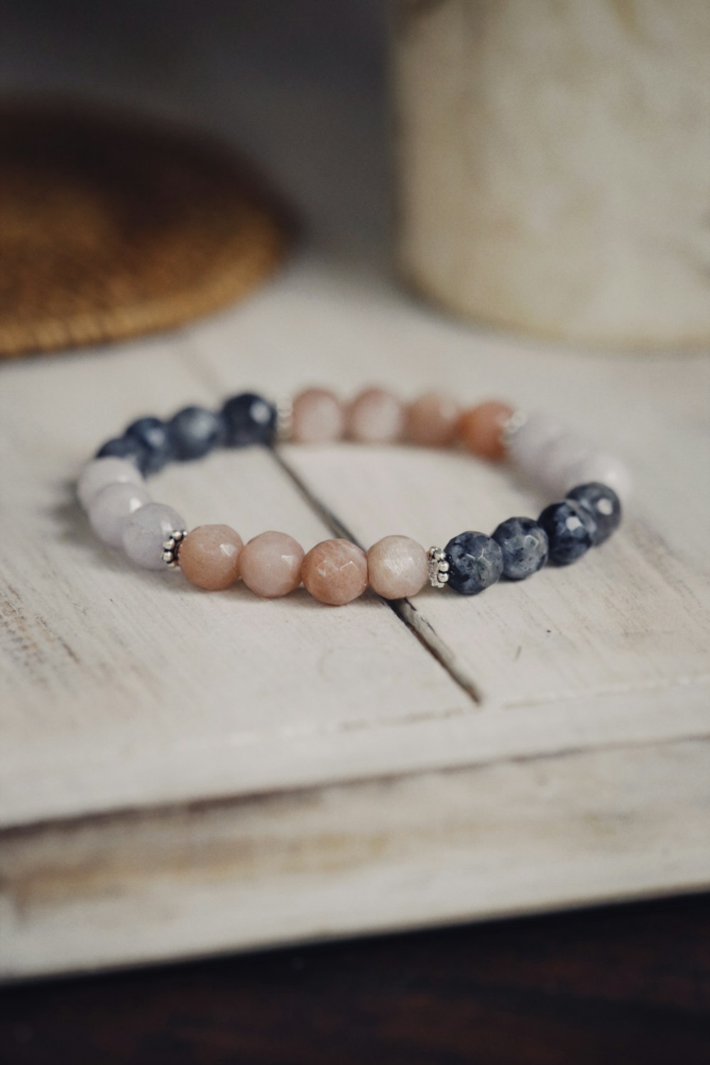 a couple of bracelets sitting on top of a table