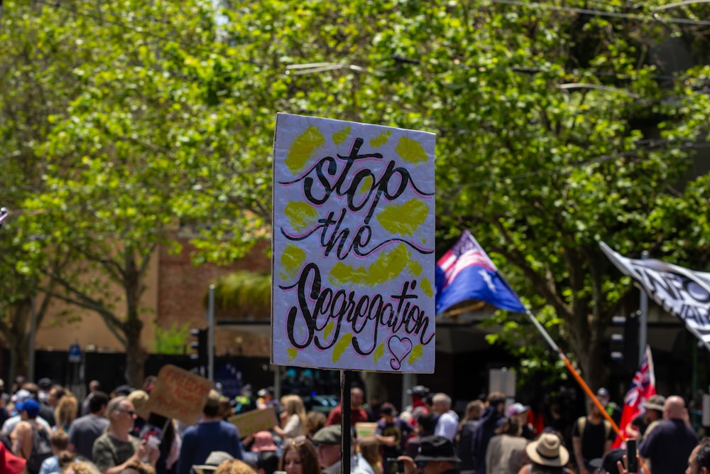 a group of people holding signs and flags