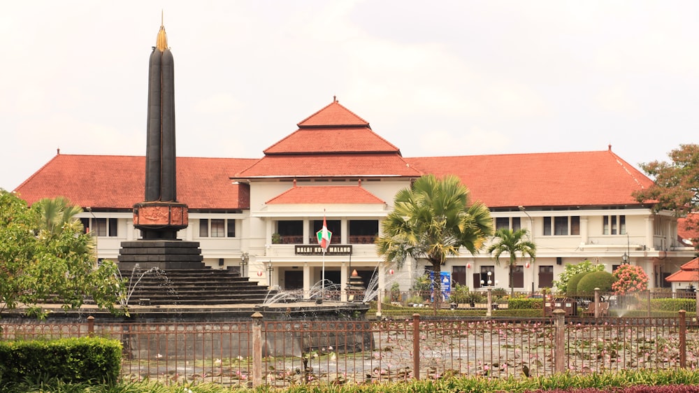 a large white building with a red roof