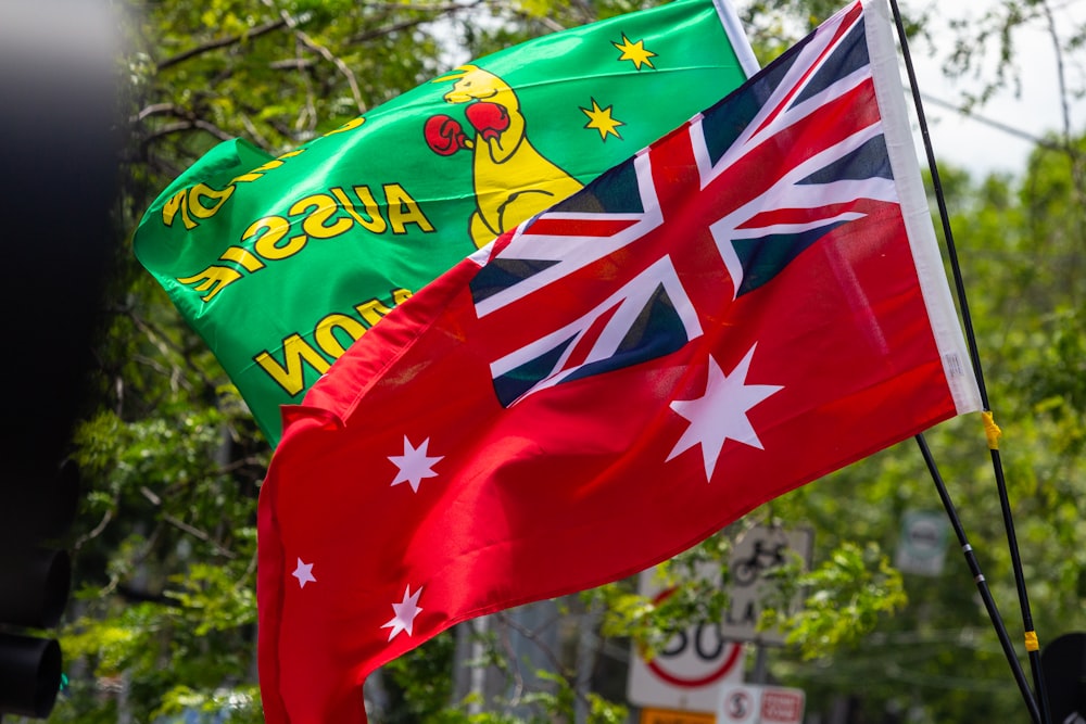 two australian and australian flags flying in the wind