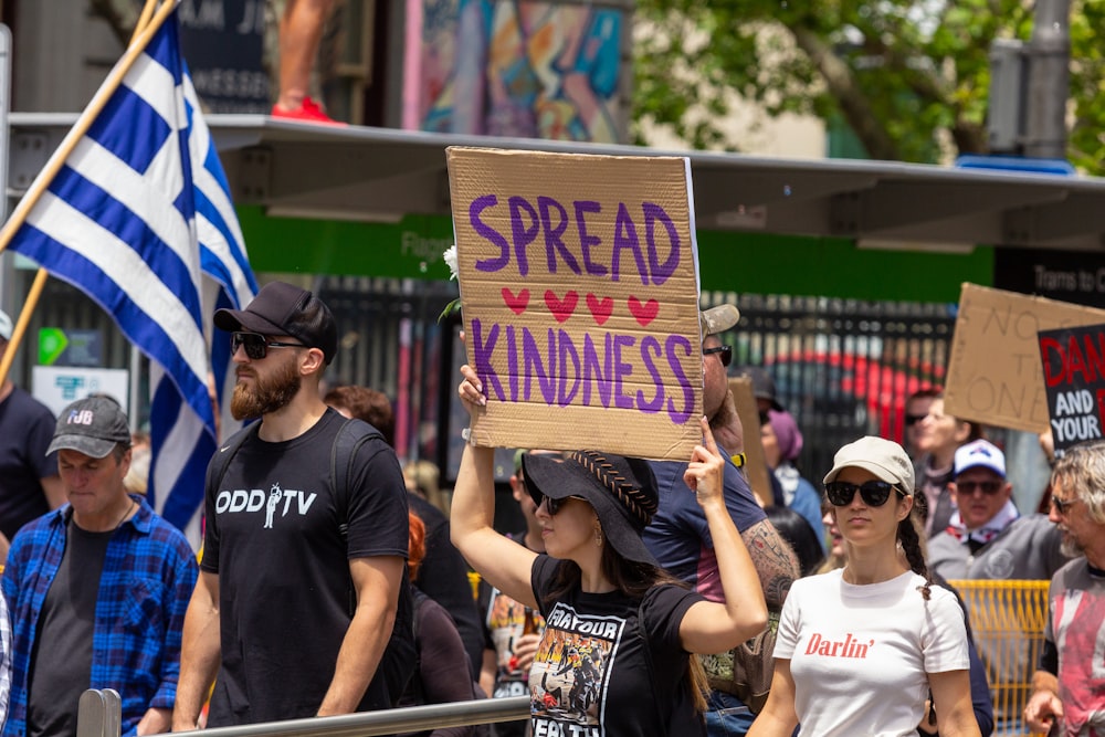 a group of people holding signs and flags