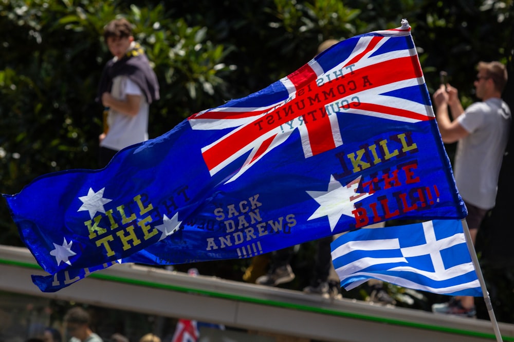 a couple of flags that are next to each other