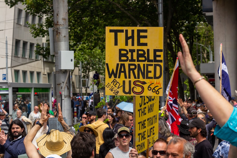 a large group of people holding up signs